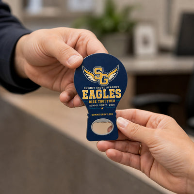 School Spirit custom logo bottle opener magnet - handed to a customer