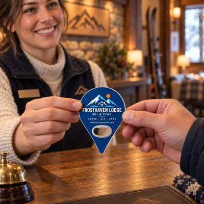 Ski Lodge custom logo bottle opener magnet - handed to a customer