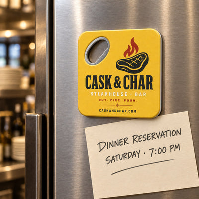 Steakhouse custom logo bottle opener magnet - held on a refrigerator door by its magnetic back