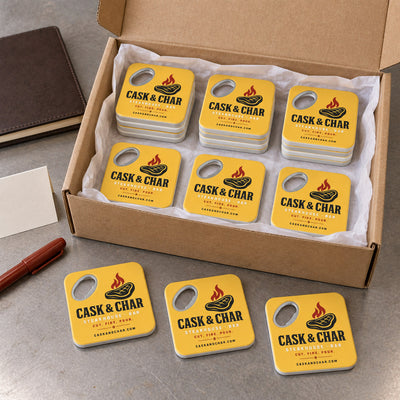 Steakhouse custom logo bottle opener magnet - bulk order laid out before packing