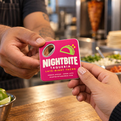 Taco Shop Promotional custom logo bottle opener magnet - handed to a customer
