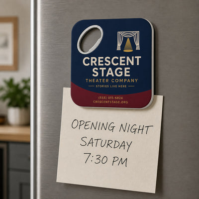 Theater Company custom logo bottle opener magnet - held on a refrigerator door by its magnetic back