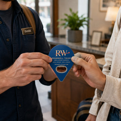 Tour Operator custom logo bottle opener magnet - handed to a customer