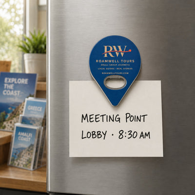 Tour Operator custom logo bottle opener magnet - held on a refrigerator door by its magnetic back