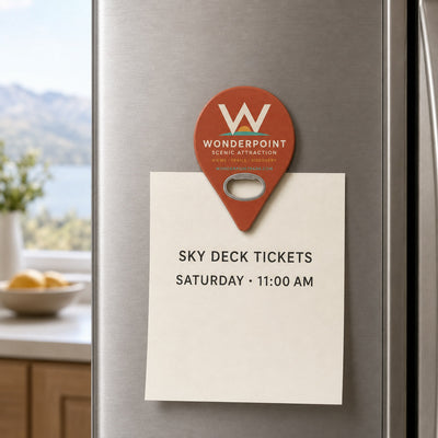 Tourist Attraction custom logo bottle opener magnet - held on a refrigerator door by its magnetic back