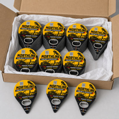 Towing Company custom logo bottle opener magnet - bulk order laid out before packing