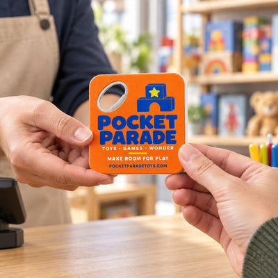 Toy Store custom logo bottle opener magnet - handed to a customer