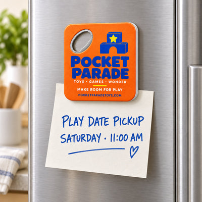 Toy Store custom logo bottle opener magnet - held on a refrigerator door by its magnetic back