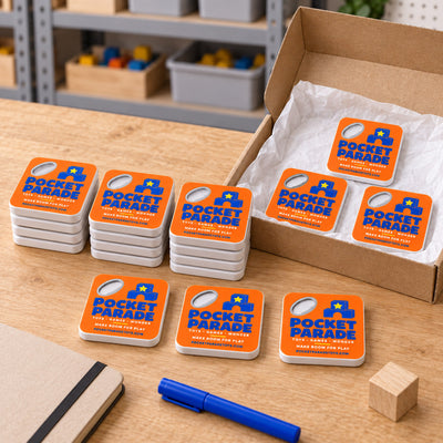 Toy Store custom logo bottle opener magnet - bulk order laid out before packing
