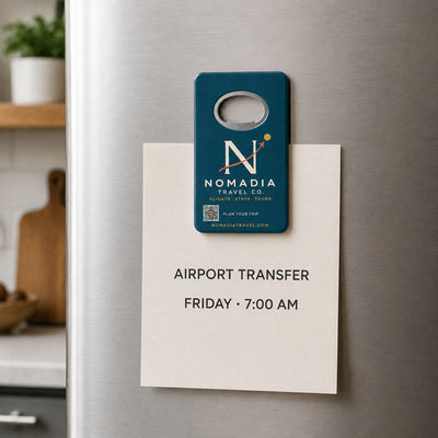 Travel Agency custom logo bottle opener magnet - held on a refrigerator door by its magnetic back