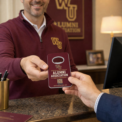 University Alumni custom logo bottle opener magnet - handed to a customer