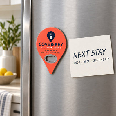 Vacation Rental Welcome custom logo bottle opener magnet - held on a refrigerator door by its magnetic back