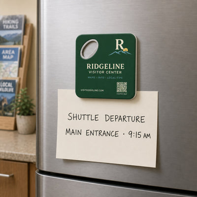 Visitor Center custom logo bottle opener magnet - held on a refrigerator door by its magnetic back